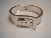 Sterling silver buckle bangle set with three cubic zirconia stones