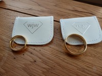 Matching yellow gold wedding rings made by the happy couple on a course