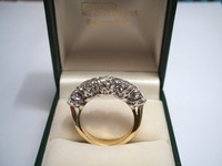 Traditional 18ct yellow and white gold five stone showing gallery setting  