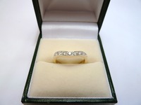 Shaped diamond set 18ct wedding ring