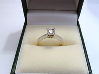 18ct yellow and white gold single stone ring set with round diamond in a sqaure setting