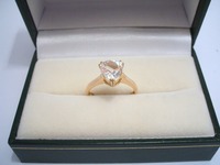 9ct yellow gold ring set with trillion cut white sapphire