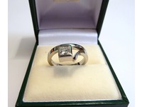 Contemporary style ring set with a single Princess cut diamond
